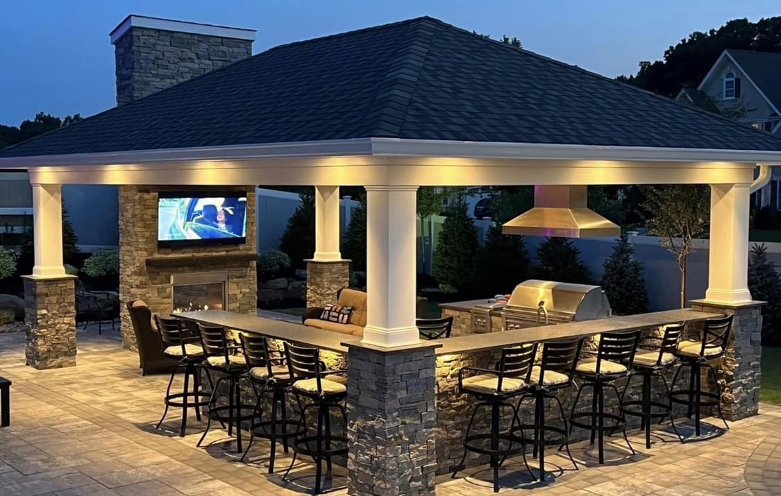 Outdoor entertaining area integrated into a custom pool project.